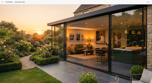 Glass-walled home extension opening onto a manicured garden