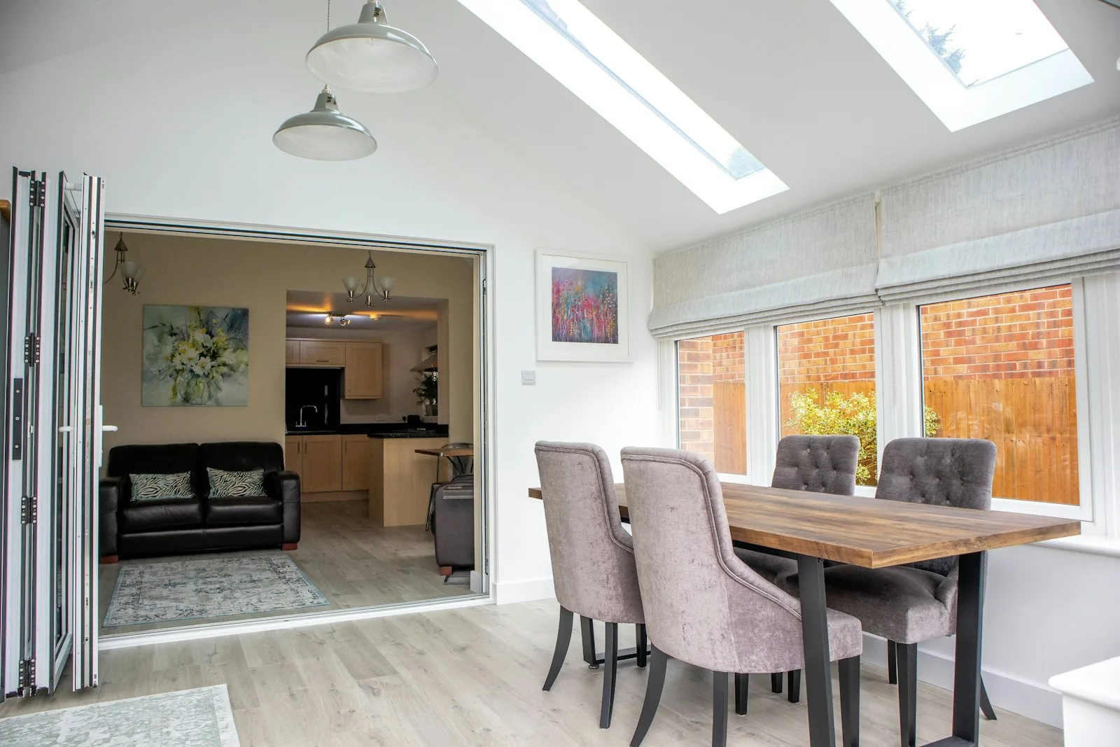 Open-plan rear extension with sliding glass doors onto a garden
