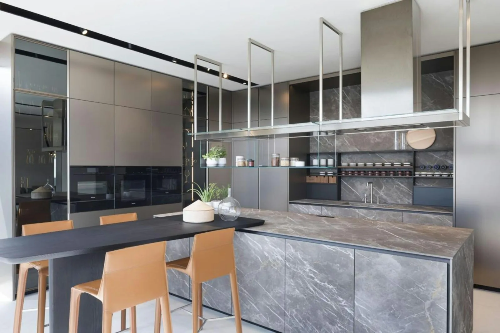 Navy cabinetry kitchen with marble waterfall island
