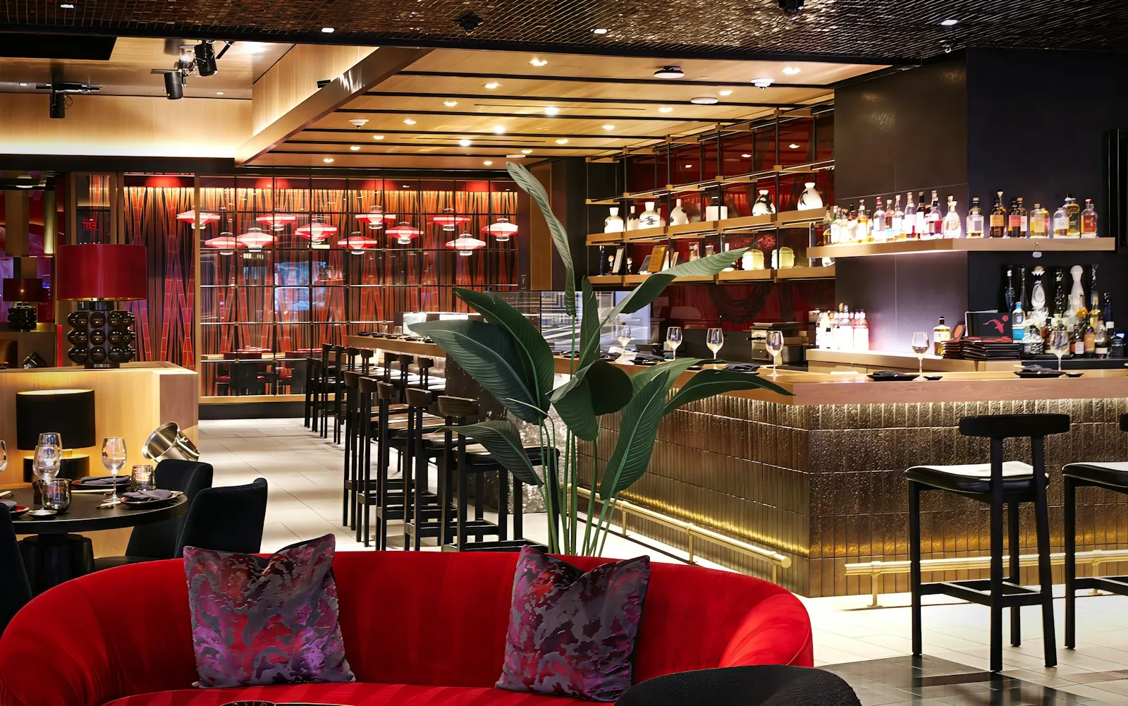 Polished brass and charcoal finishes in a commercial interior