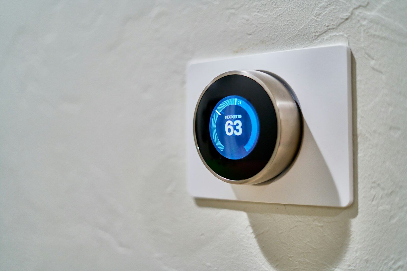 Smart thermostat mounted on a textured wall
