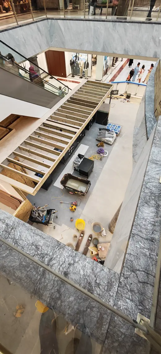 Elevated view of the kiosk structure and protected retail surroundings during fit-out