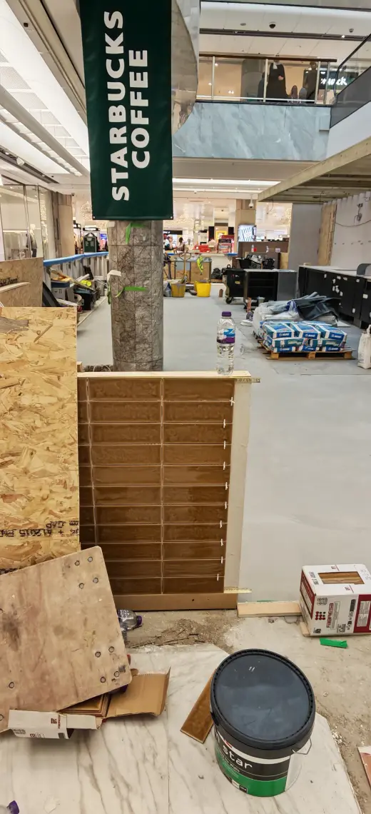 Timber framing and wall build-up progressing around the coffee kiosk