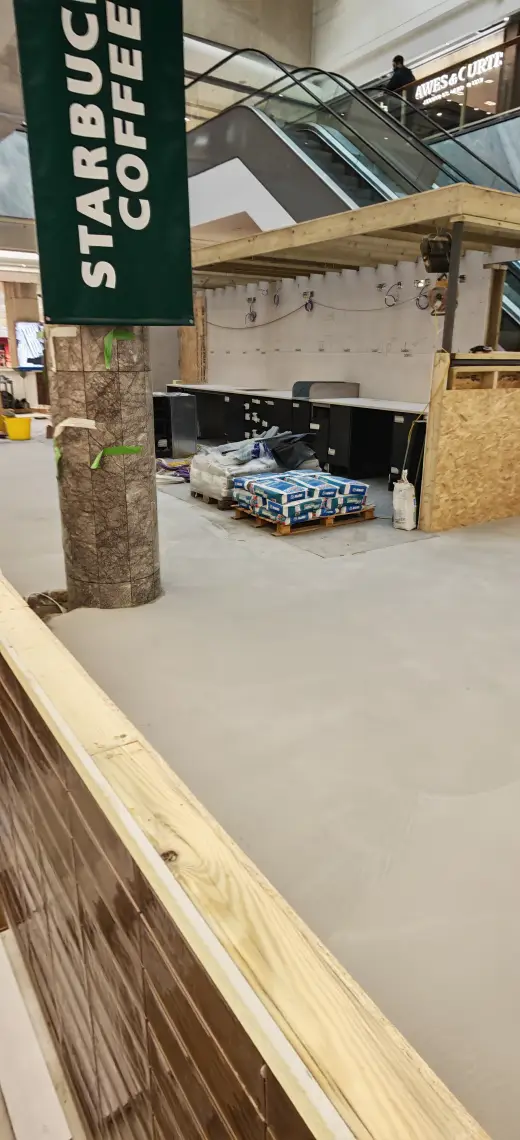 Service cabling and site equipment staged during the kiosk fit-out