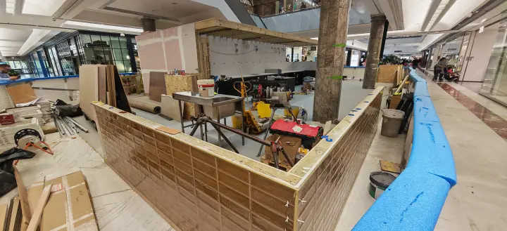 Counter enclosure and wall lining in progress in the retail fit-out