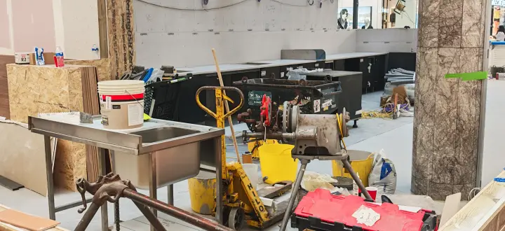 Kiosk perimeter, temporary boarding and floor works during construction