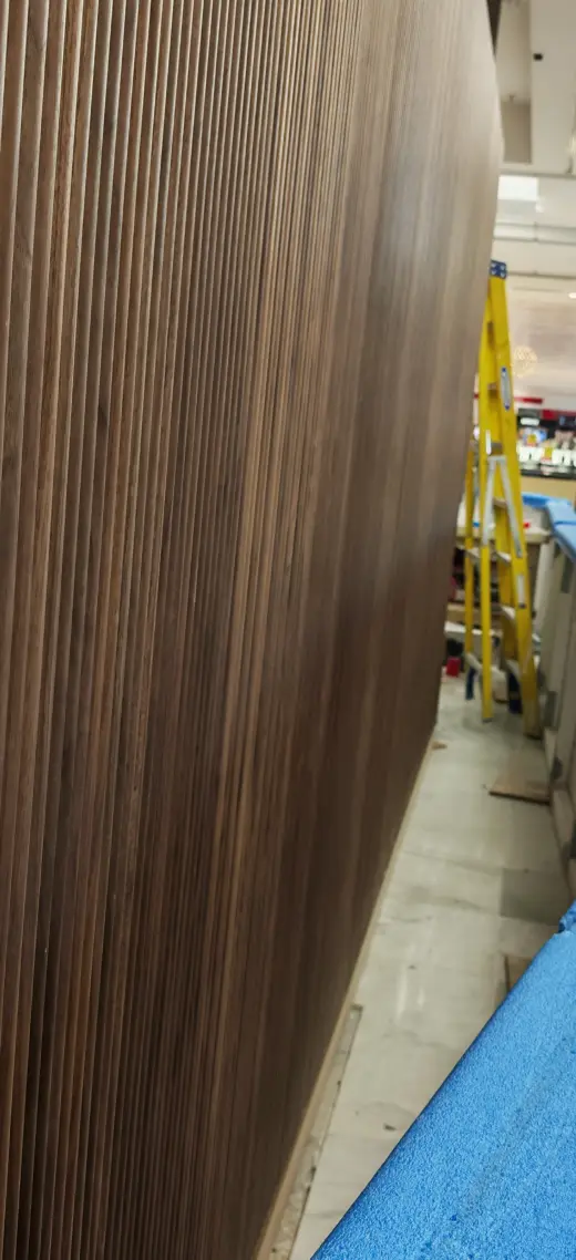 Close progress view of decorative timber cladding for the kiosk