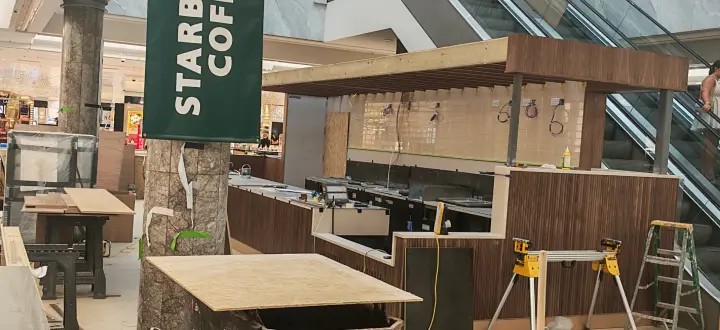 Later-stage wide view of the current commercial coffee kiosk fit-out